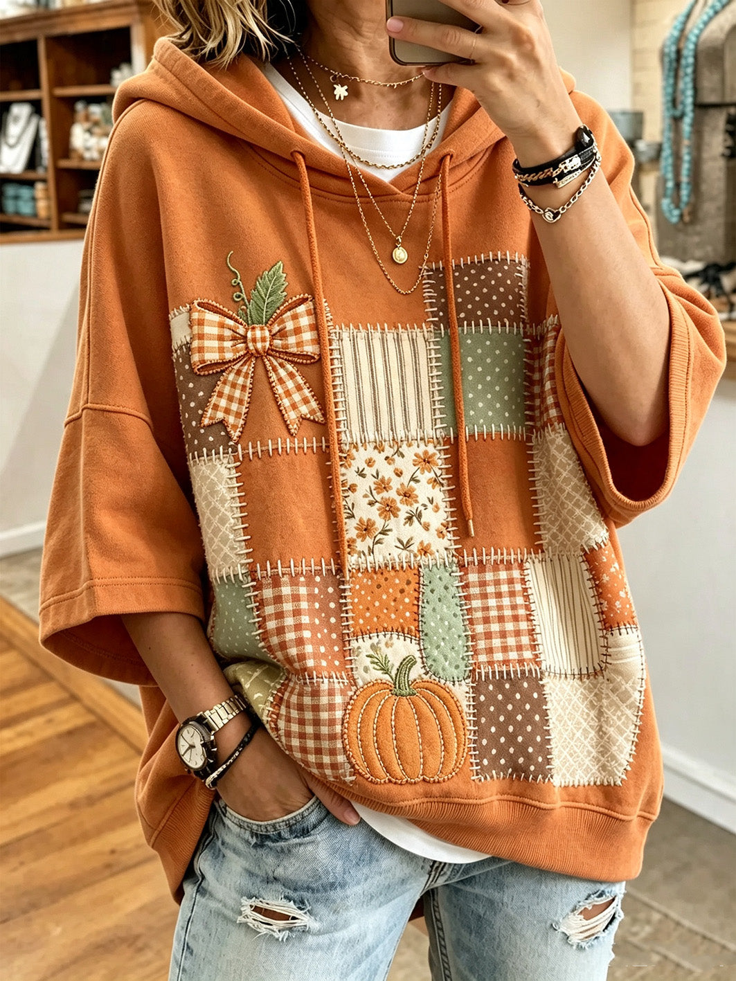 Larisa | Sudadera oversize con capucha y estampado otoñal